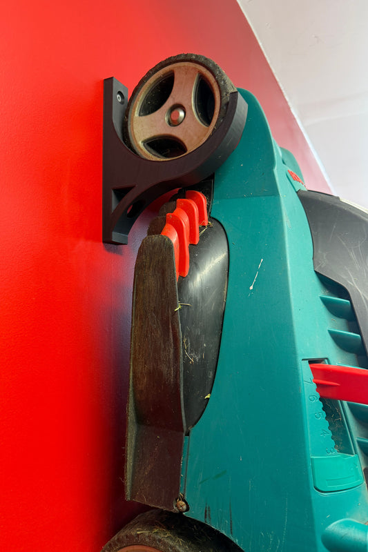 Veggfeste for batteridrevne gressklipppere
